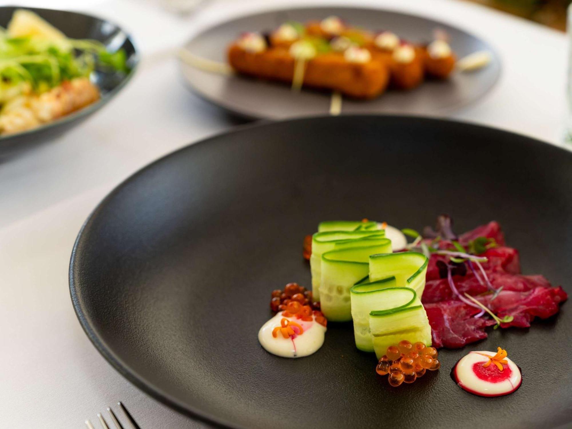 Pullman Cairns International Hotel Buitenkant foto A plate of food at the restaurant